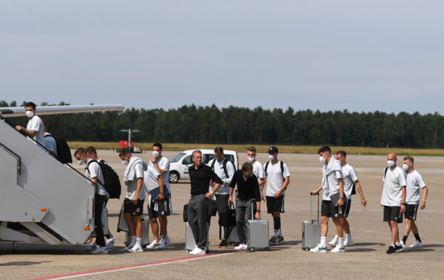 , Cheeky schoolkids BOO Germany team as they arrive at London hotel for England Euro 2020 showdown