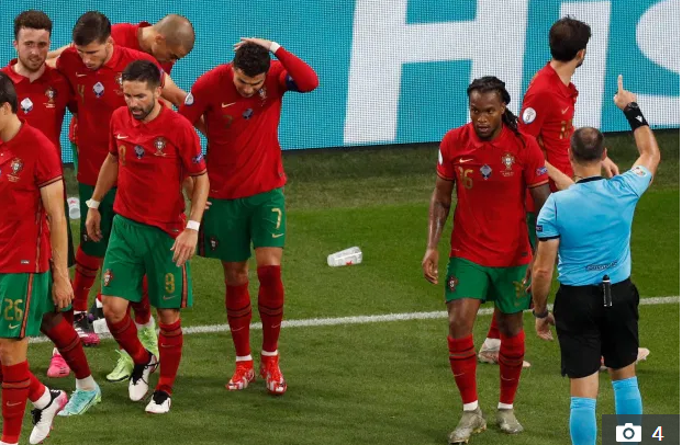 , Cristiano Ronaldo has Coca-Cola bottle thrown at him before Euro 2020 stewards protect Portugal star from pitch invader