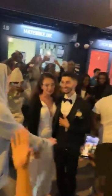 Excited fans cheered as the newlywed couple kissed and hugged in Shoreditch 