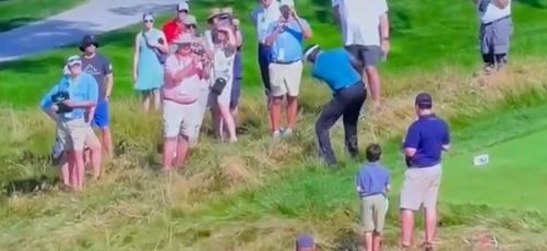 , Hilarious moment Vijay Singh shanks ball and hits fan who falls off chair spilling beer on himself at US Senior Open