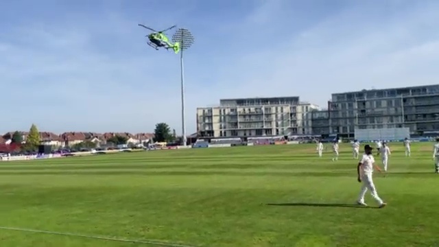 , Astonishing moment HELICOPTER lands on cricket pitch and stops play as air ambulance rushes to deal with emergency