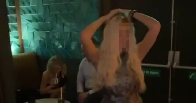 , Football legend Paul Scholes gets touchy-feely during very public lap dance