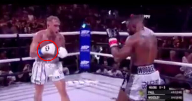 , Jake Paul and Tyron Woodley accused of FIXING fight by fans after ‘secret hand signal’ spotted moments before KO