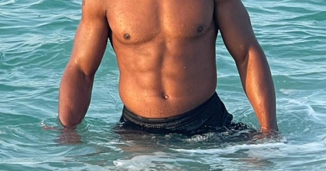 , Anthony Joshua channels inner James Bond as he shows off bulging muscles in ocean after refusing to give up Usyk fight