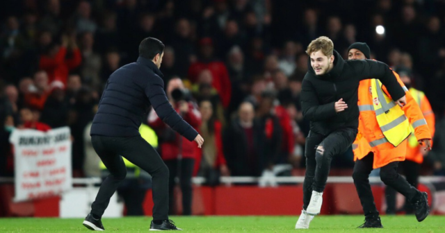 , Watch as Arsenal boss Arteta is forced to jump out of pitch invader’s path as fan storms pitch after win over West Ham