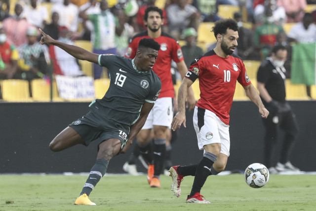 , Mo Salah kindly poses for selfie with Nigeria’s coach as Liverpool star is ambushed on pitch after Egypt’s Afcon defeat