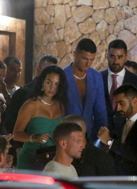 , Cristiano Ronaldo and Georgina Rodriguez can’t keep hands off each other as stunning Wag wears strapless dress on date