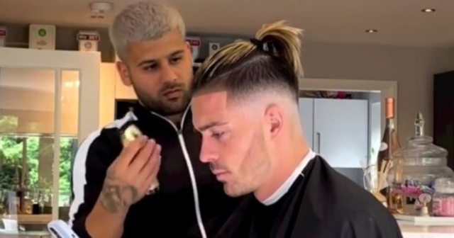 , Man City star Jack Grealish shows off new top knot haircut after returning from holidays for pre-season