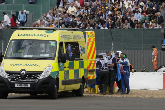 , Watch terrified spectators run for their lives as Zhou Guanyu’s car rolls upside down towards them at British GP