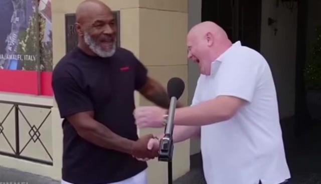 , Watch hilarious moment Mike Tyson turns up behind tourist who claimed he would get in ring with boxing legend