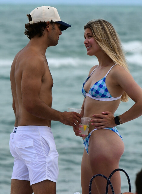 , Genie Bouchard stuns in blue bikini on Miami beach before being fed sushi and cuddling male friend in back of taxi