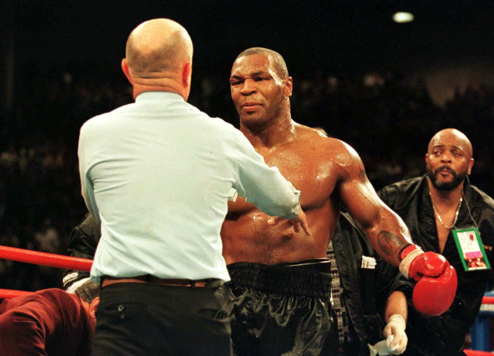 , Mike Tyson hugs ref Mills Lane in touching throwback snap years after disqualifying him for biting Holyfield’s ear off