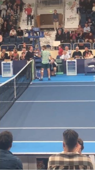 , Watch tensions boil over at tennis event as players have to be pulled apart by umpire after fiery exchange