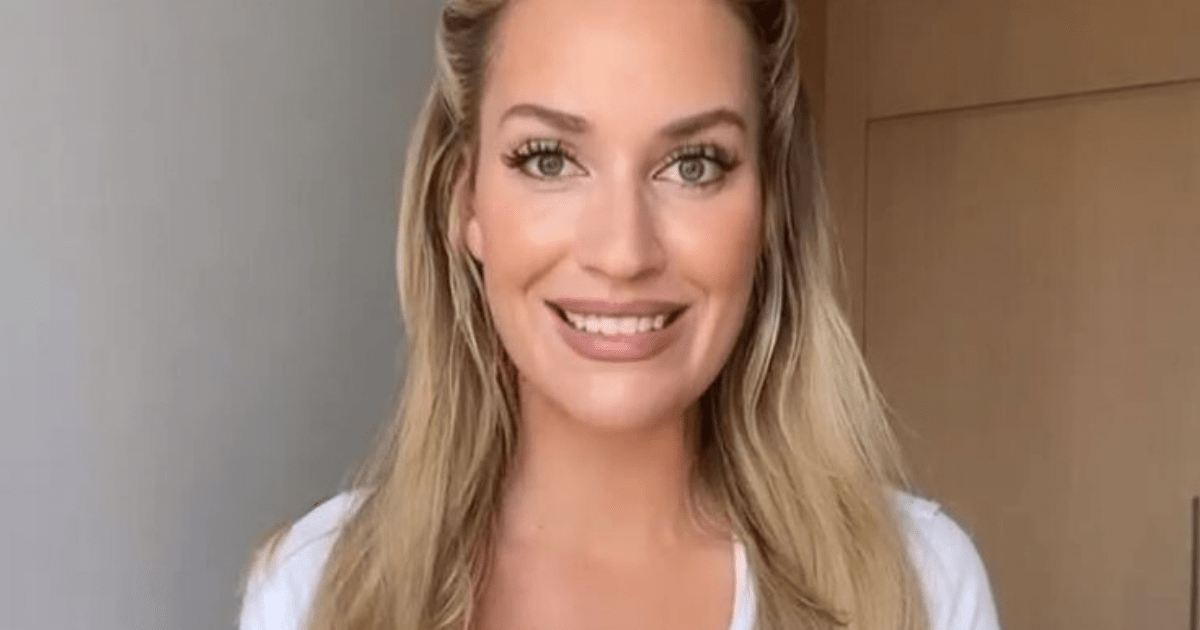, Paige Spiranac stuns in very revealing low-cut shirt as fan jokes ‘that button is doing everything possible to hang on’