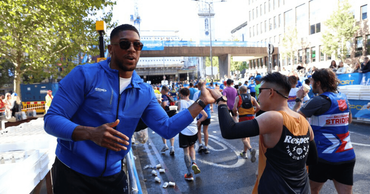 , Anthony Joshua hands out drinks to stunned London Marathon runners who stop for selfies as Tyson Fury talks rumble on