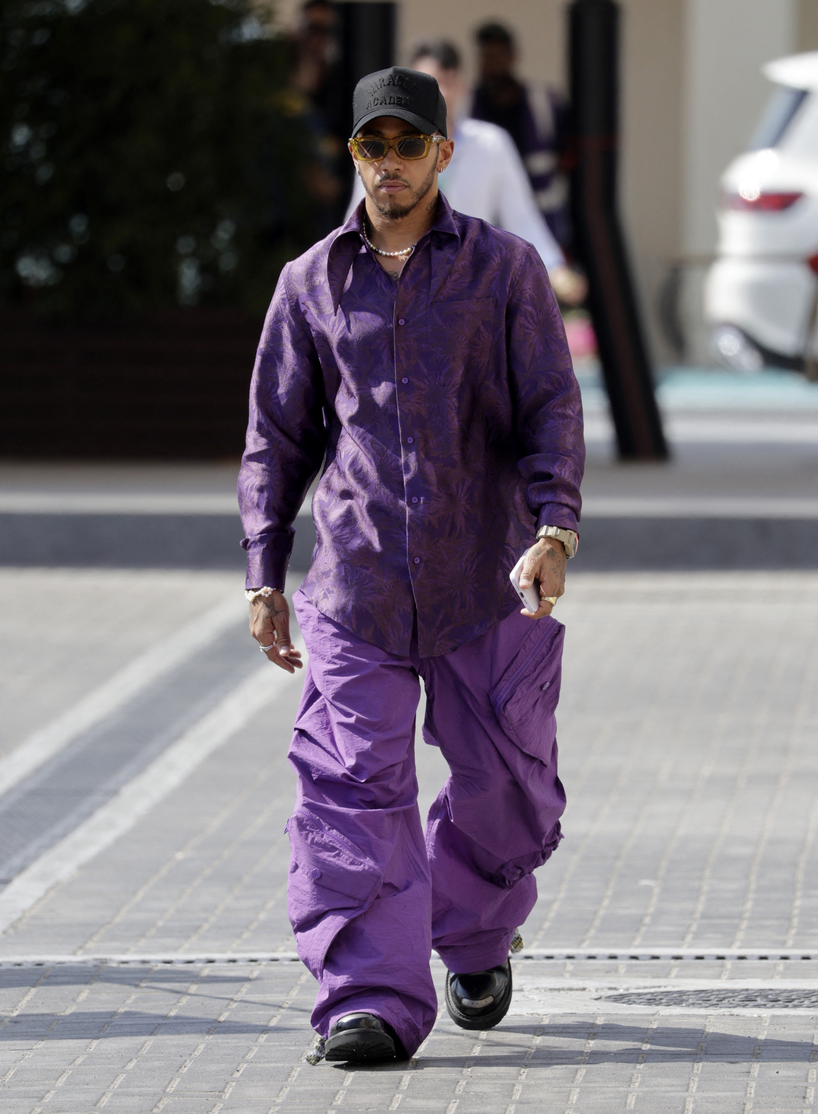 , Lewis Hamilton returns to Abu Dhabi a year on from Max Verstappen F1 title chaos in incredible all-purple ensemble