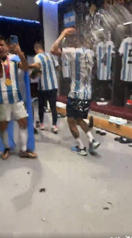 , Inside Argentina’s wild dressing room celebrations as Messi dances with $10m cheque and star SOMERSAULTS into bin