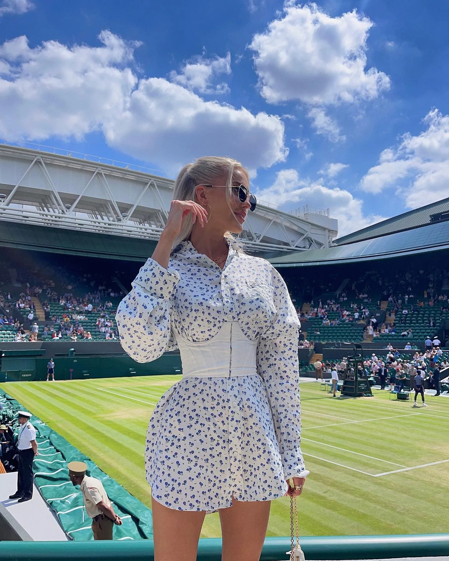 The tennis wag wore a stunning floral dress to cheer on her man at SW19