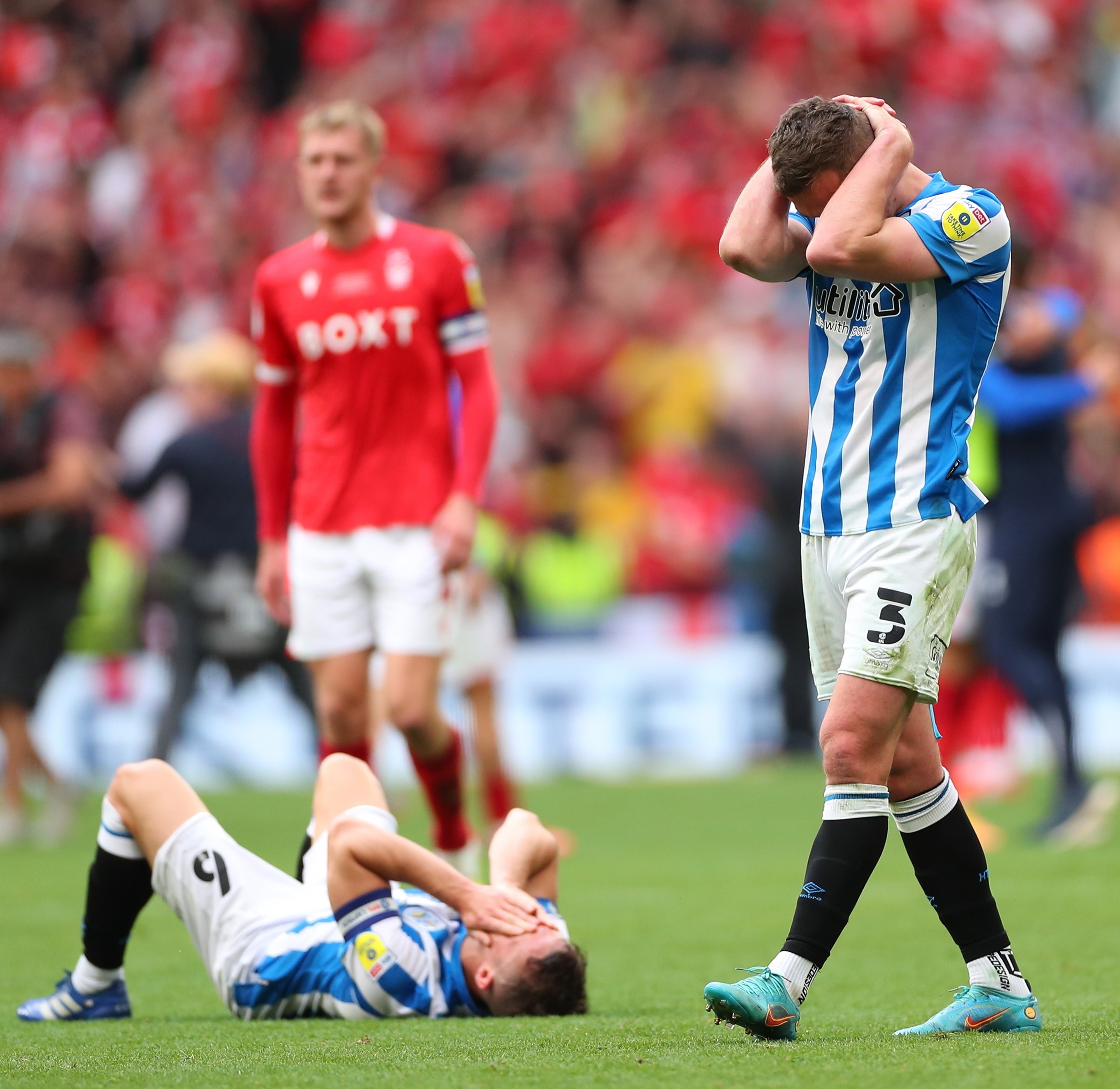 LONDON, ENGLAND - MAY 29: Harry Toffolo of Huddersfield Town dejected at full time of the Sky Bet Championship Play-Off Final match between Huddersfield Town and Nottingham Forest at Wembley Stadium on May 29, 2022 in London, England. (Photo by Robbie Jay Barratt - AMA/Getty Images)