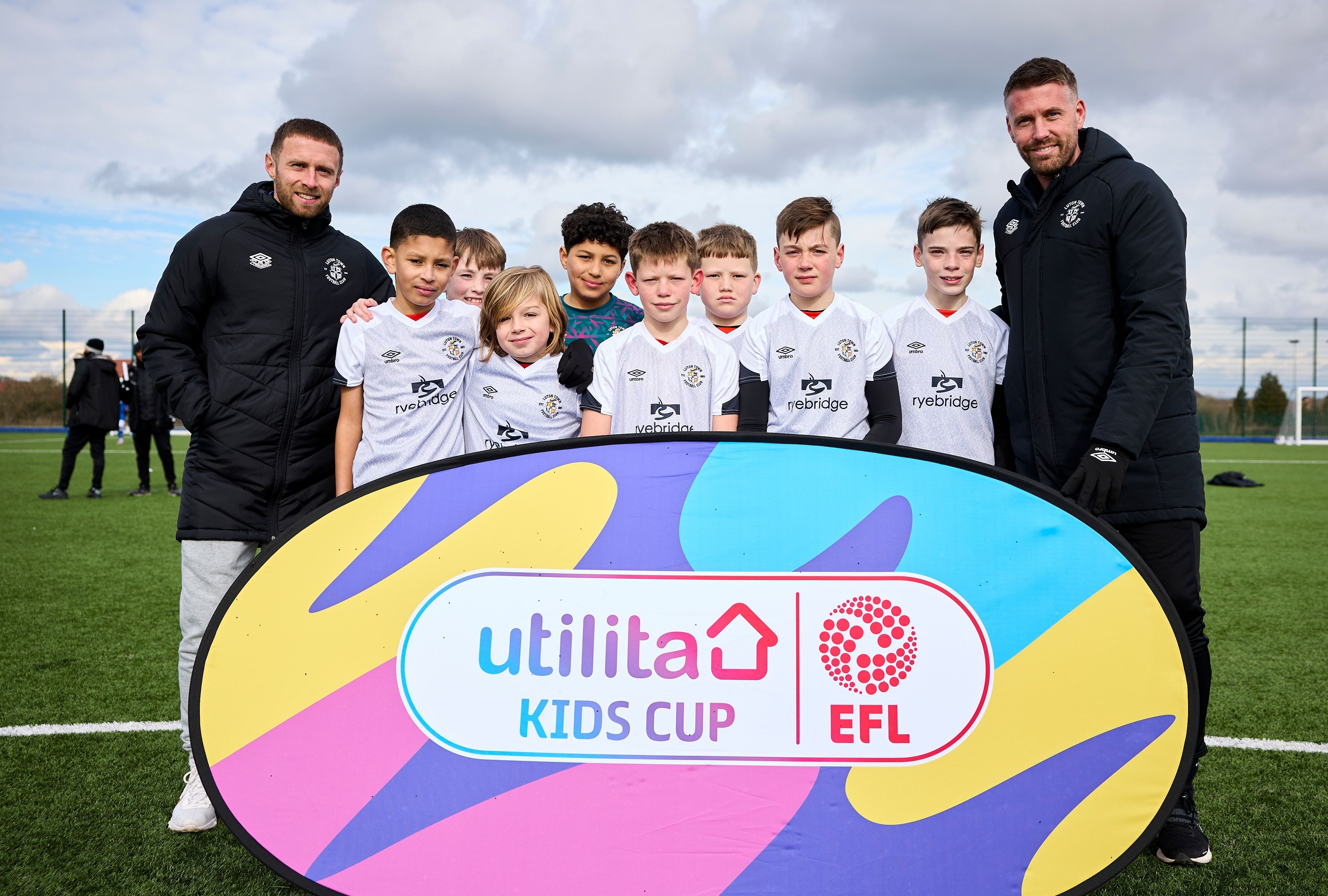 Mandatory Credit: Photo by Shutterstock (13794824af) Rob Edwards manager of Luton Town and Jordan Clark of Luton Town pose for a team picture with children representing Luton Town Football Club Utilita Kids Cup, Football, Creasey Park Football Centre, Bedford, UK - 07 Mar 2023