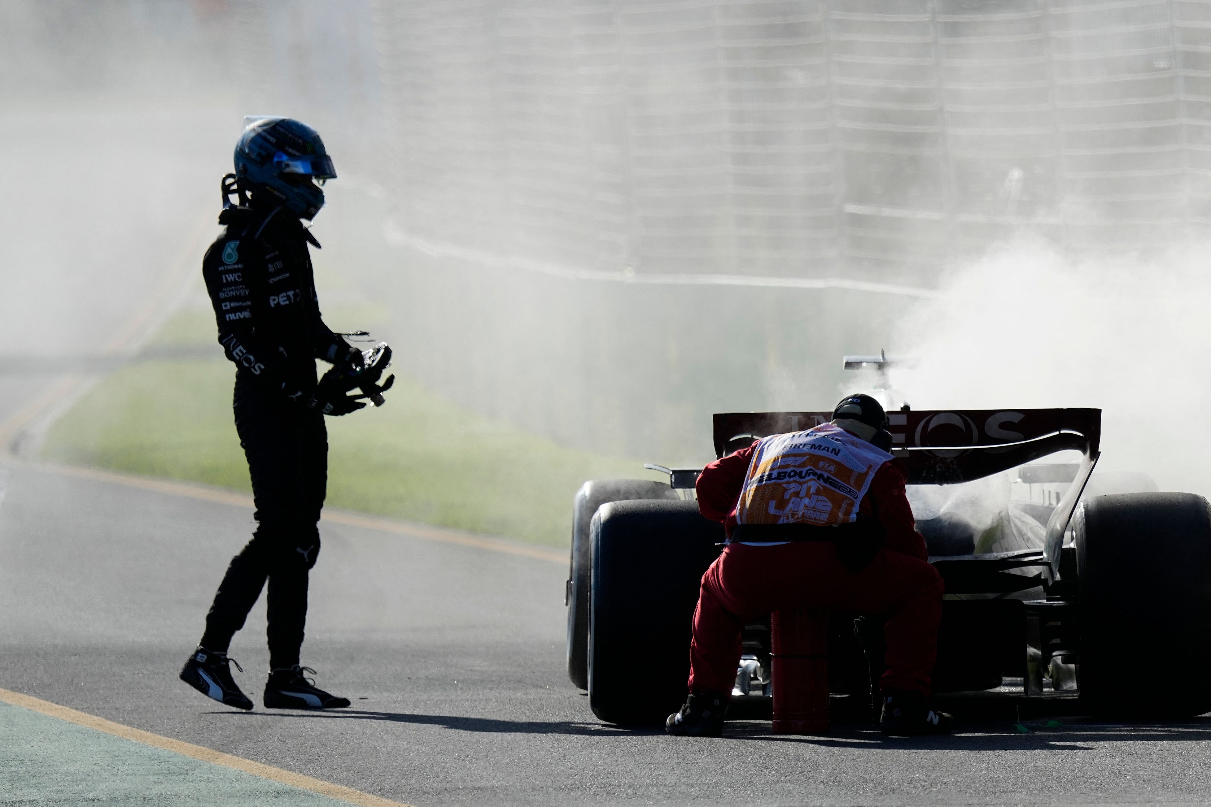 , F1 star George Russell pulls out of Australian GP as car SETS ON FIRE after Lewis Hamilton’s Mercedes pal had led race