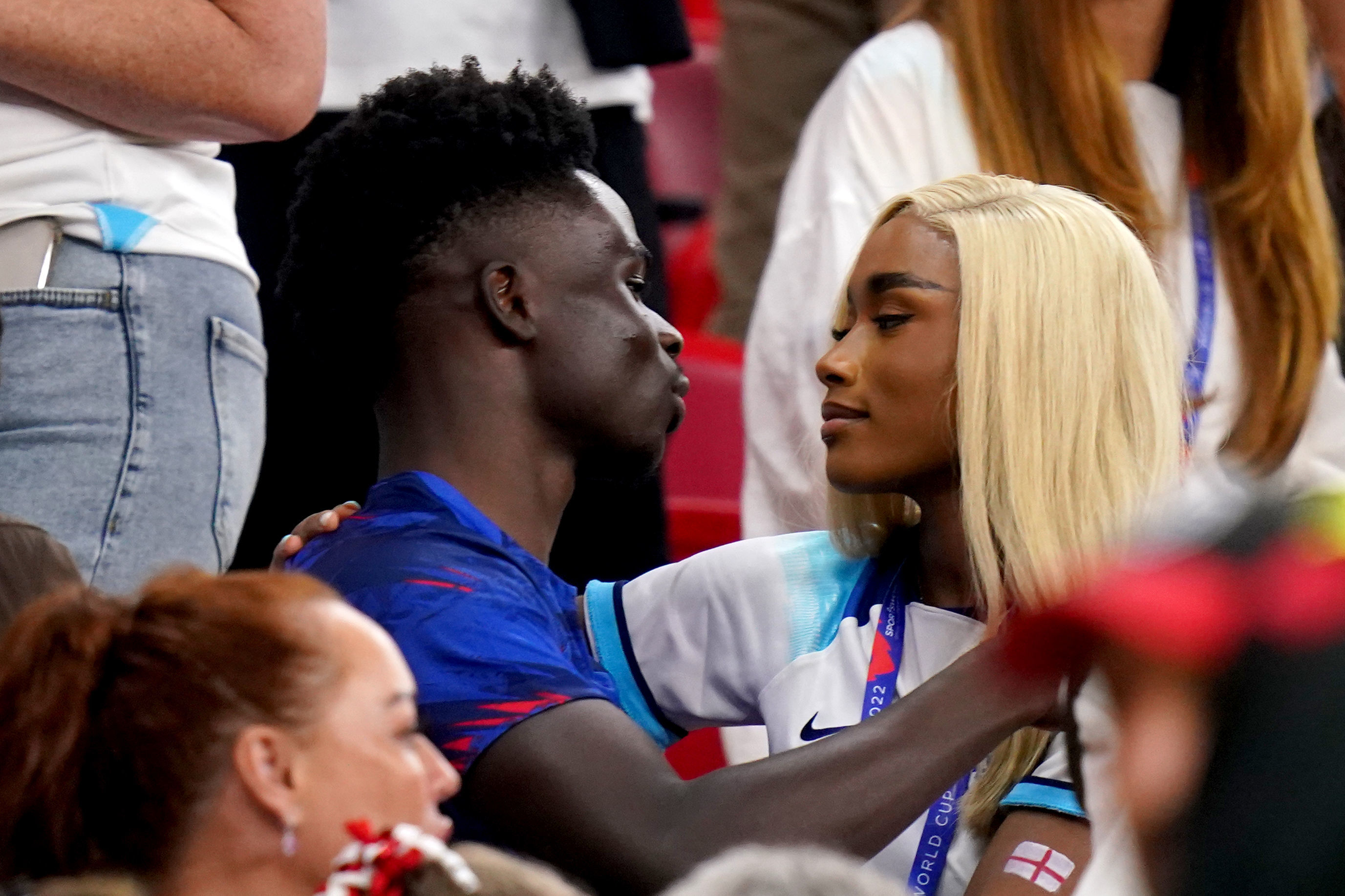 England's Bukayo Saka with his partner Tolami Benson after the match during the FIFA World Cup Group B match at the Ahmad Bin Ali Stadium, Al Rayyan, Qatar. Picture date: Tuesday November 29, 2022. PA Photo. See PA story WORLDCUP Wales. Photo credit should read: Adam Davy/PA Wire. RESTRICTIONS: Use subject to restrictions. Editorial use only, no commercial use without prior consent from rights holder.