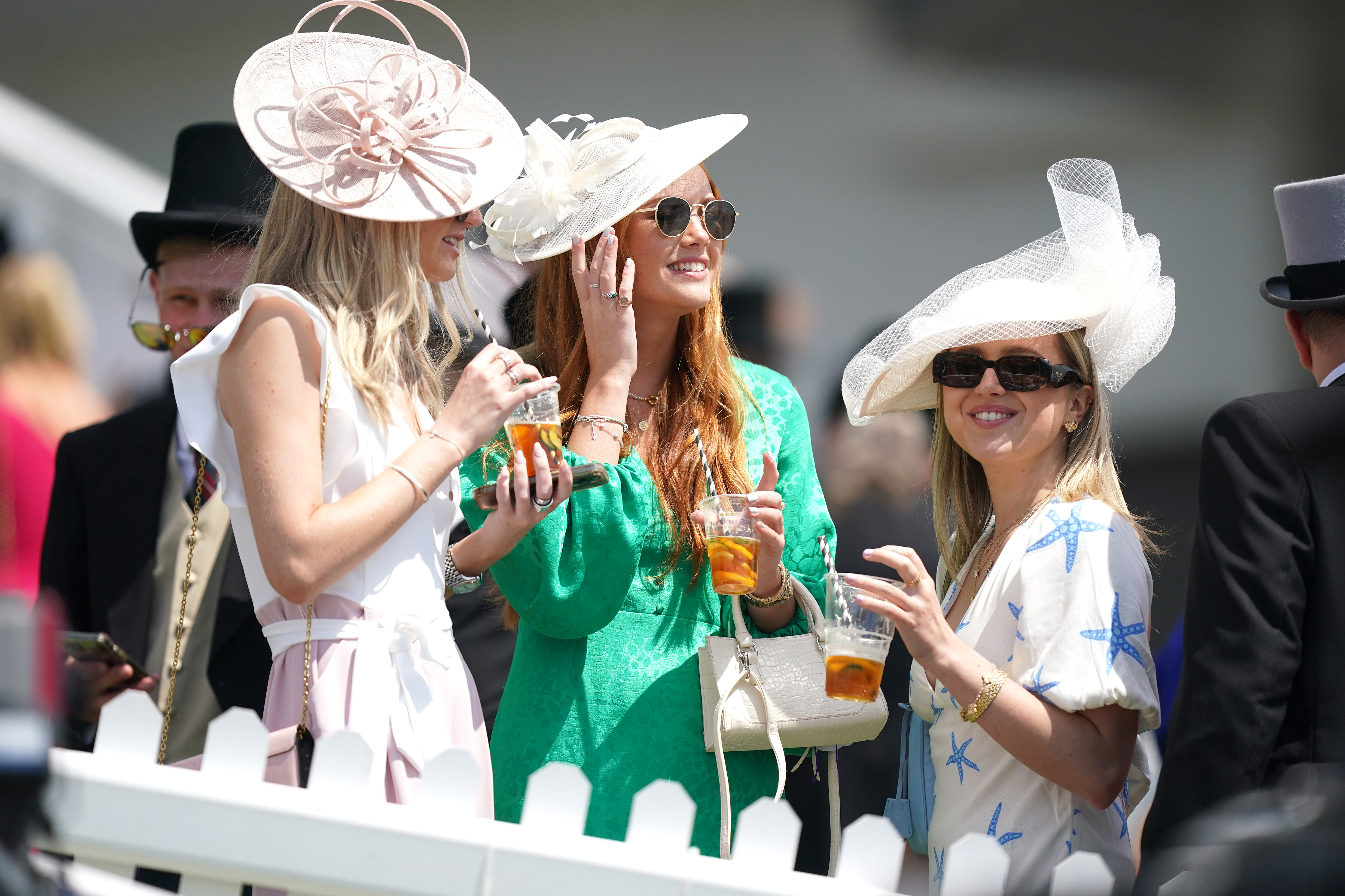 , Glam racegoers pull out all the style stops as they arrive for Derby Day at Epsom Downs racecourse