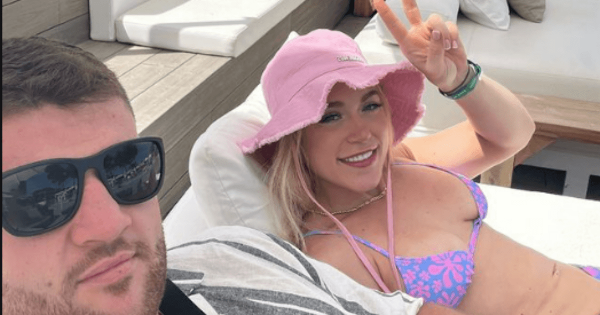 , Elle Brooke relaxes in bikini in Magaluf then bursts into laughter as her huge boxer pal is ‘started on’