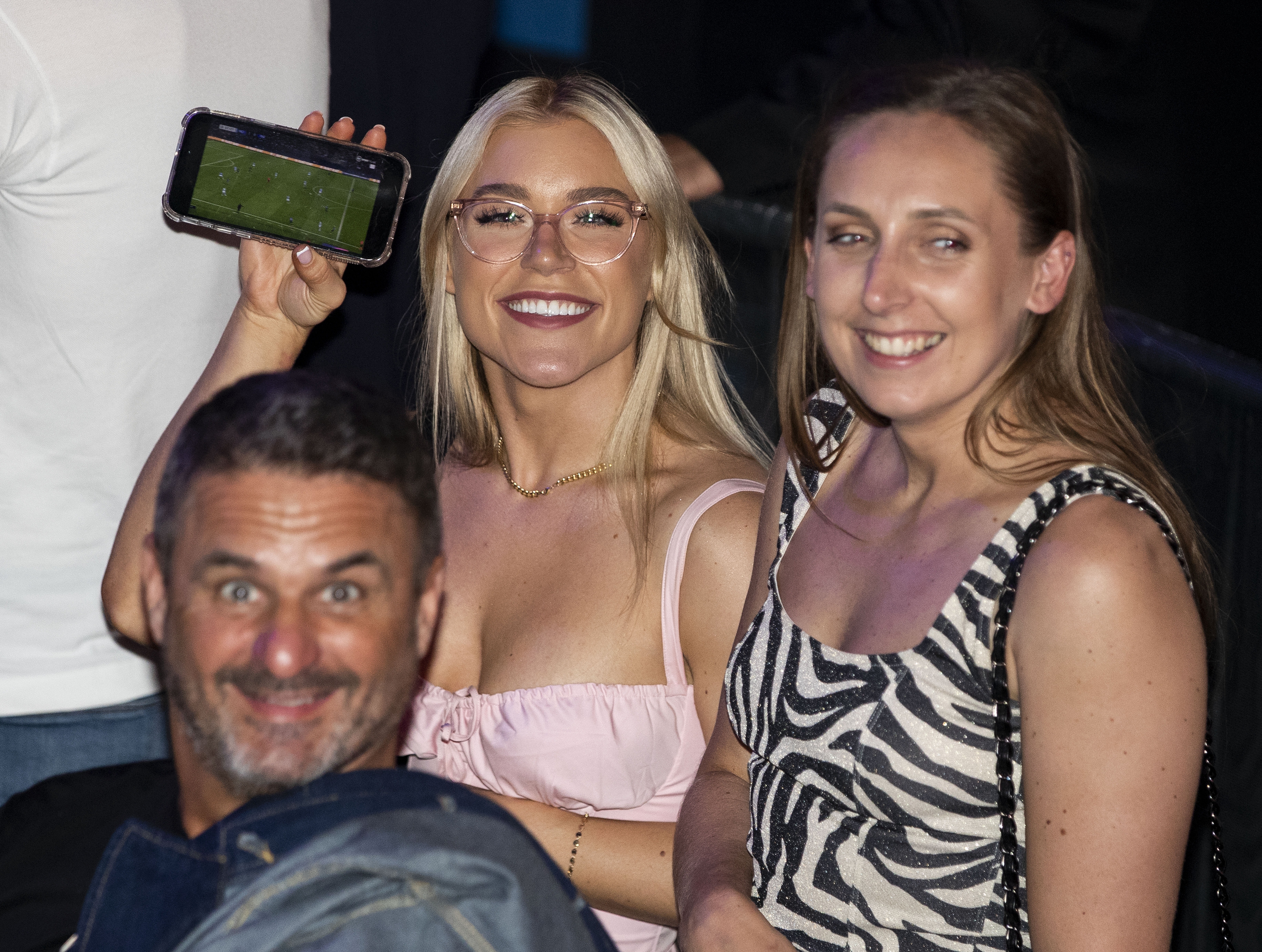 , Elle Brooke joins no bra club as Man City superfan watches treble win on her phone at the boxing