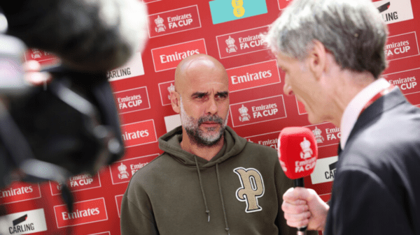, Why does Pep Guardiola have ‘P’ on his hoodie during Manchester City games?