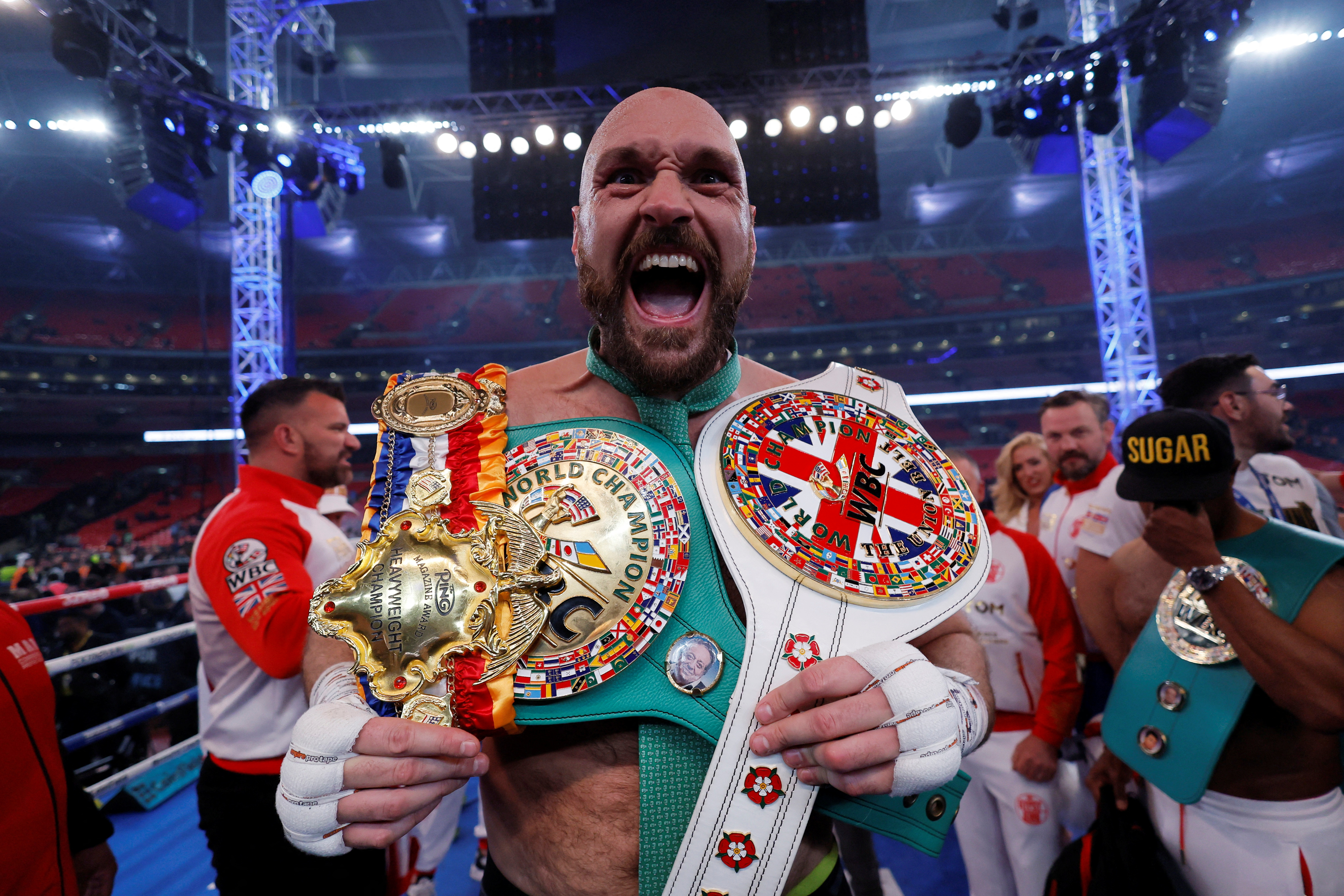 FILE PHOTO: Boxing - Tyson Fury v Dillian Whyte - WBC World Heavyweight Title - Wembley Stadium, London, Britain - April 23, 2022 Tyson Fury celebrates with the belts after winning his fight against Dillian Whyte Action Images via Reuters/Andrew Couldridge/File Photo